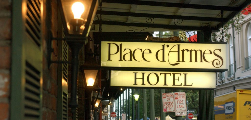 Illuminated sign at the Place D'Armes NOLA